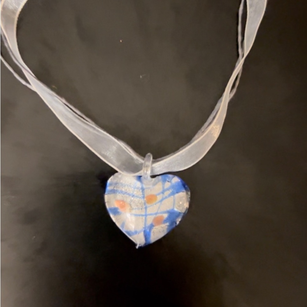 Handmade blue glass heart pendant necklace.